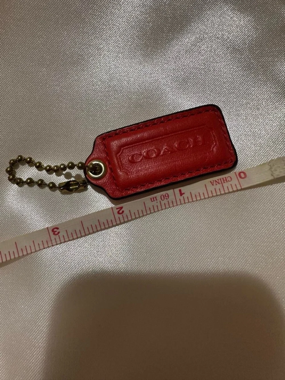 COACH Red Leather Hang Tag with Gold Chain